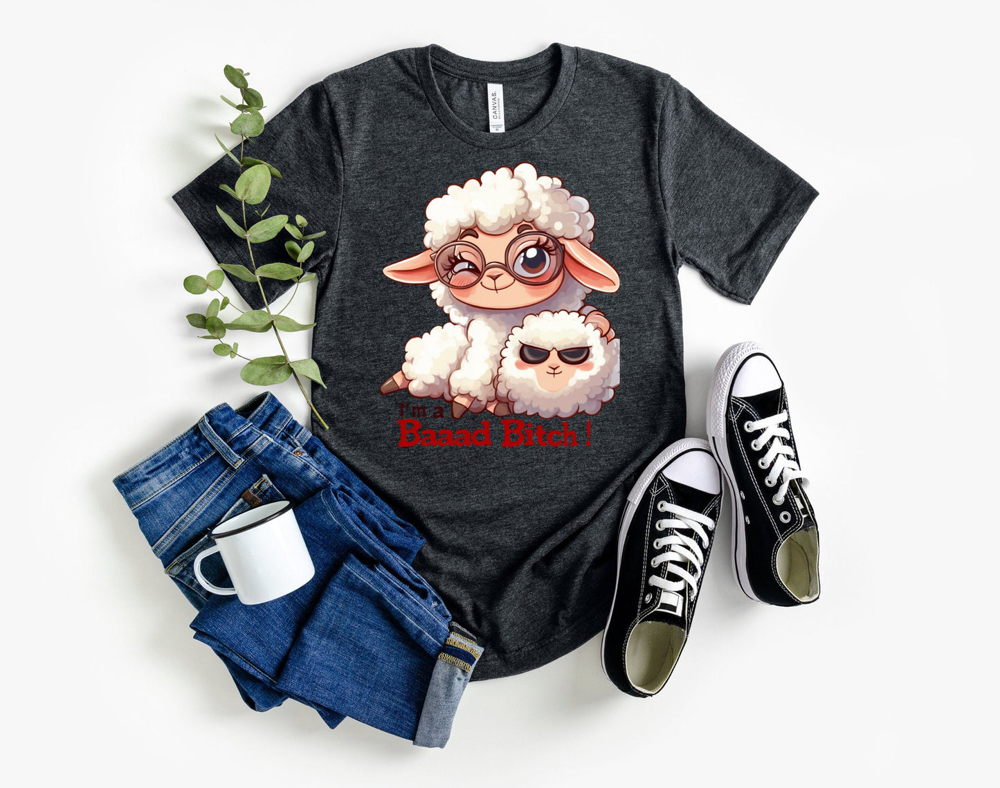 Pink T Shirt with a cute sheep wearing glasses and the words Im a baaad bitch in black and Red Letters. The Sheep is holding a smaller sheep with black eyes that look like sunglasses. www.scorpiontees.etsy.com
