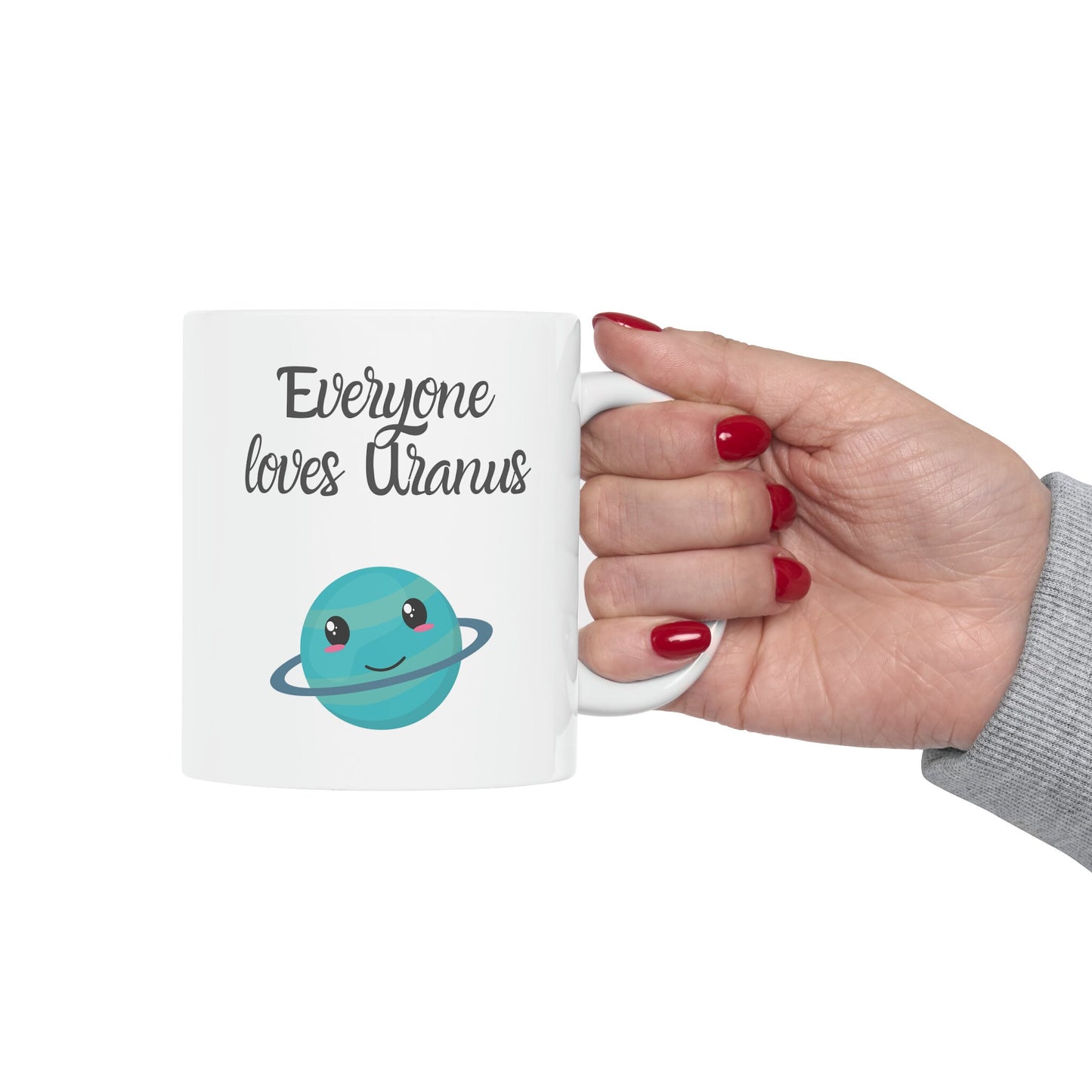 White Ceramic Mug with words in Script style black font that say, Everyone Loves Uranus. Beneath you find a Cute graphic of the Planet Uranus with an adorable face.  Check out the shop for more items at www.scorpiontees.etsy.com