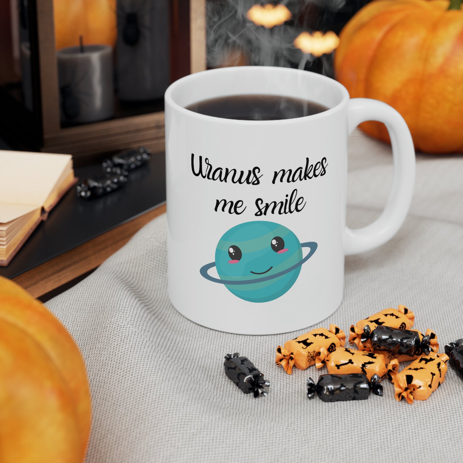 White Ceramic Mug with words in Script style black font that say, Uranus makes me smile. Beneath you find a Cute graphic of the Planet Uranus with an adorable face.  Check out the shop for more items at www.scorpiontees.etsy.com