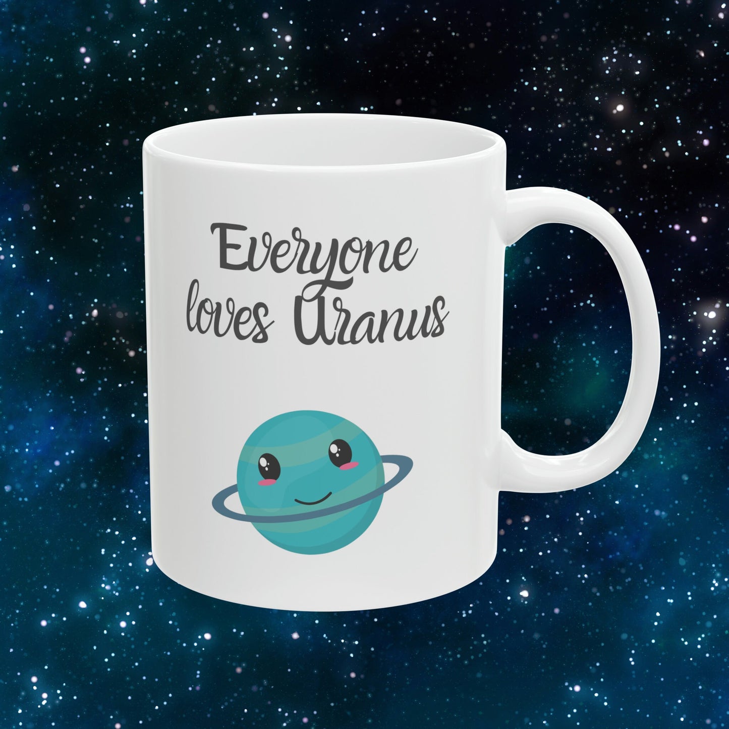 White Ceramic Mug with words in Script style black font that say, Everyone Loves Uranus. Beneath you find a Cute graphic of the Planet Uranus with an adorable face.  Check out the shop for more items at www.scorpiontees.etsy.com