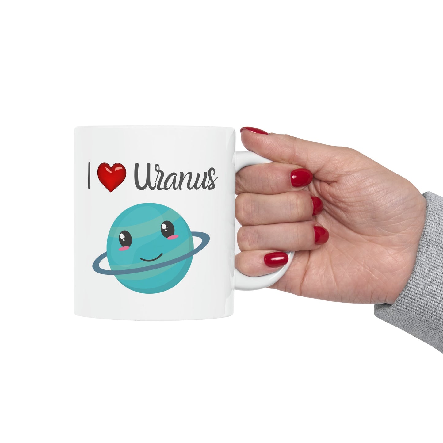 White Ceramic Mug with words in Script style black font that say, I Love Uranus.  Love as a red heart symbol.  Beneath you find a Cute graphic of the Planet Uranus with an adorable face.  Check out the shop for more items at www.scorpiontees.etsy.com