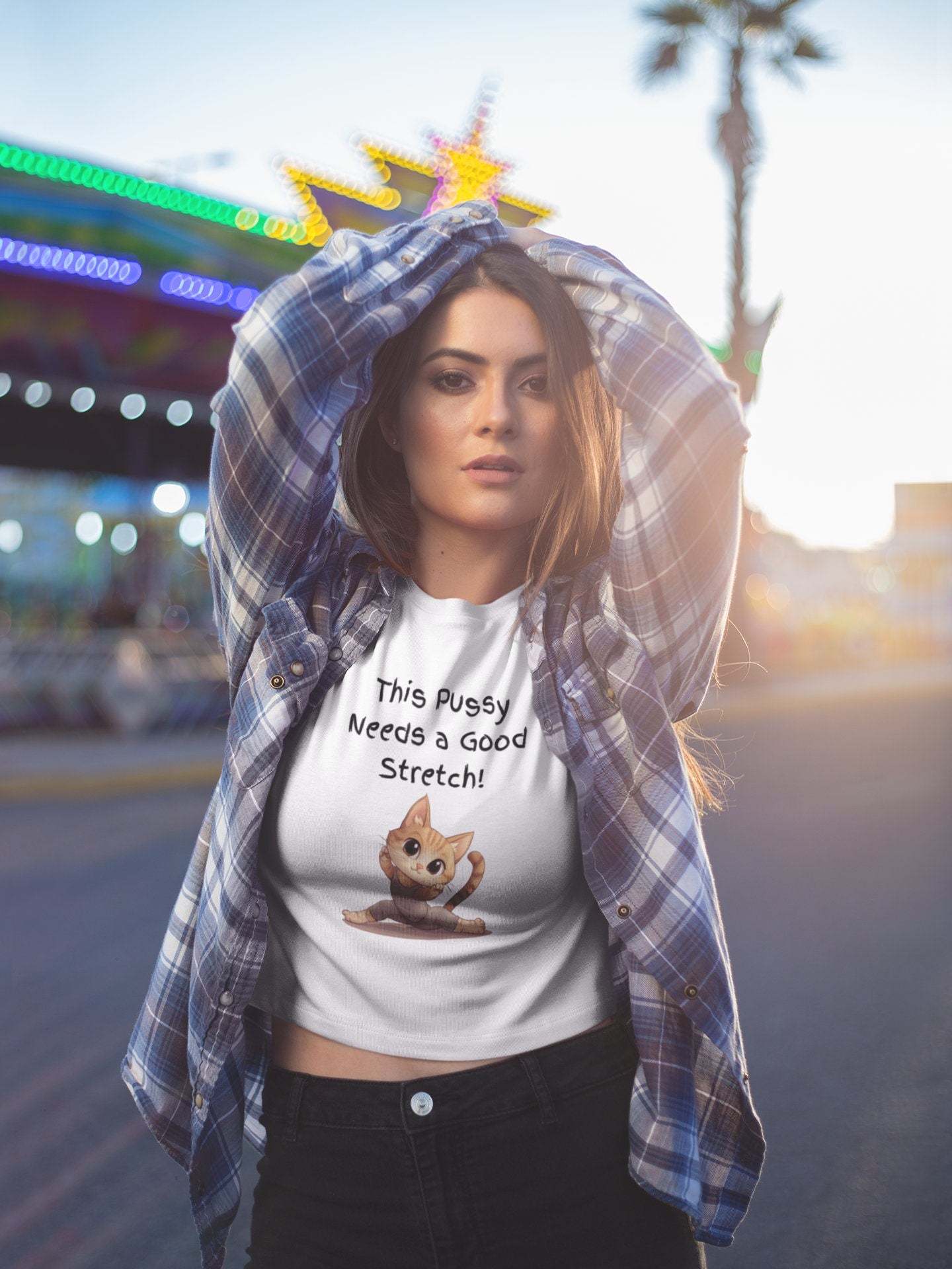 Bella and Canvas 3001 T Shirt with the Words This pussy needs a good stretch in finger paint font. Below the words there is a Cartoon cat stretching doing a split. Hilarious sexy shirt while stylish and comfortable