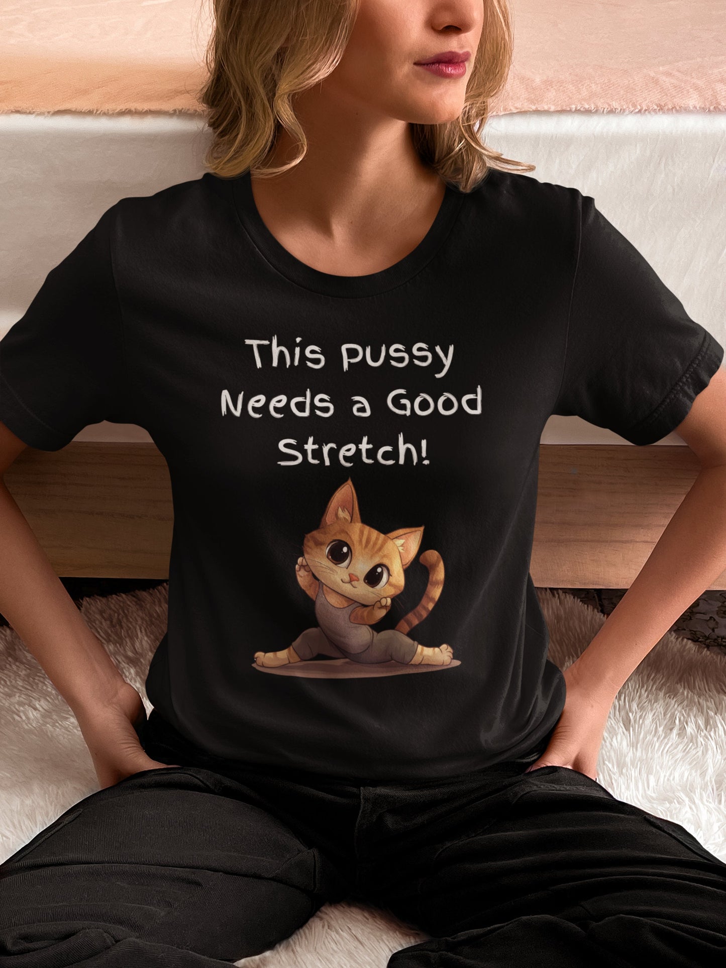Bella and Canvas 3001 T Shirt with the Words This pussy needs a good stretch in finger paint font. Below the words there is a Cartoon cat stretching doing a split. Hilarious sexy shirt while stylish and comfortable