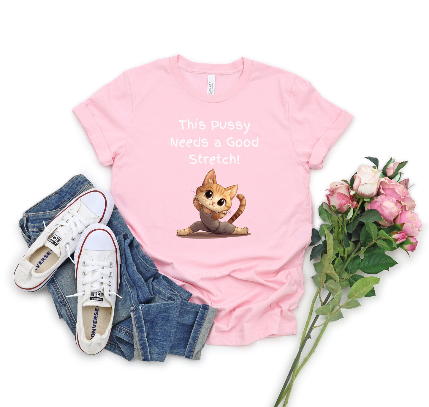 Bella and Canvas 3001 T Shirt with the Words This pussy needs a good stretch in finger paint font. Below the words there is a Cartoon cat stretching doing a split. Hilarious sexy shirt while stylish and comfortable