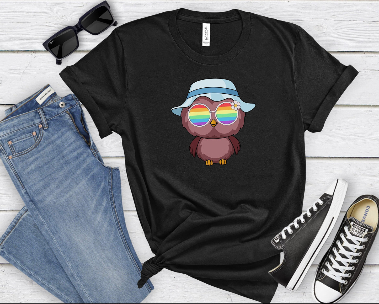 Super cute owl with rainbow glasses shirt blue hat, Rainbow glasses on an adorable owl, precious owl showing off pride. Beautiful pride owl