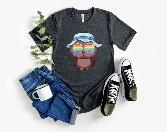 Super cute owl with rainbow glasses shirt blue hat, Rainbow glasses on an adorable owl, precious owl showing off pride. Beautiful pride owl