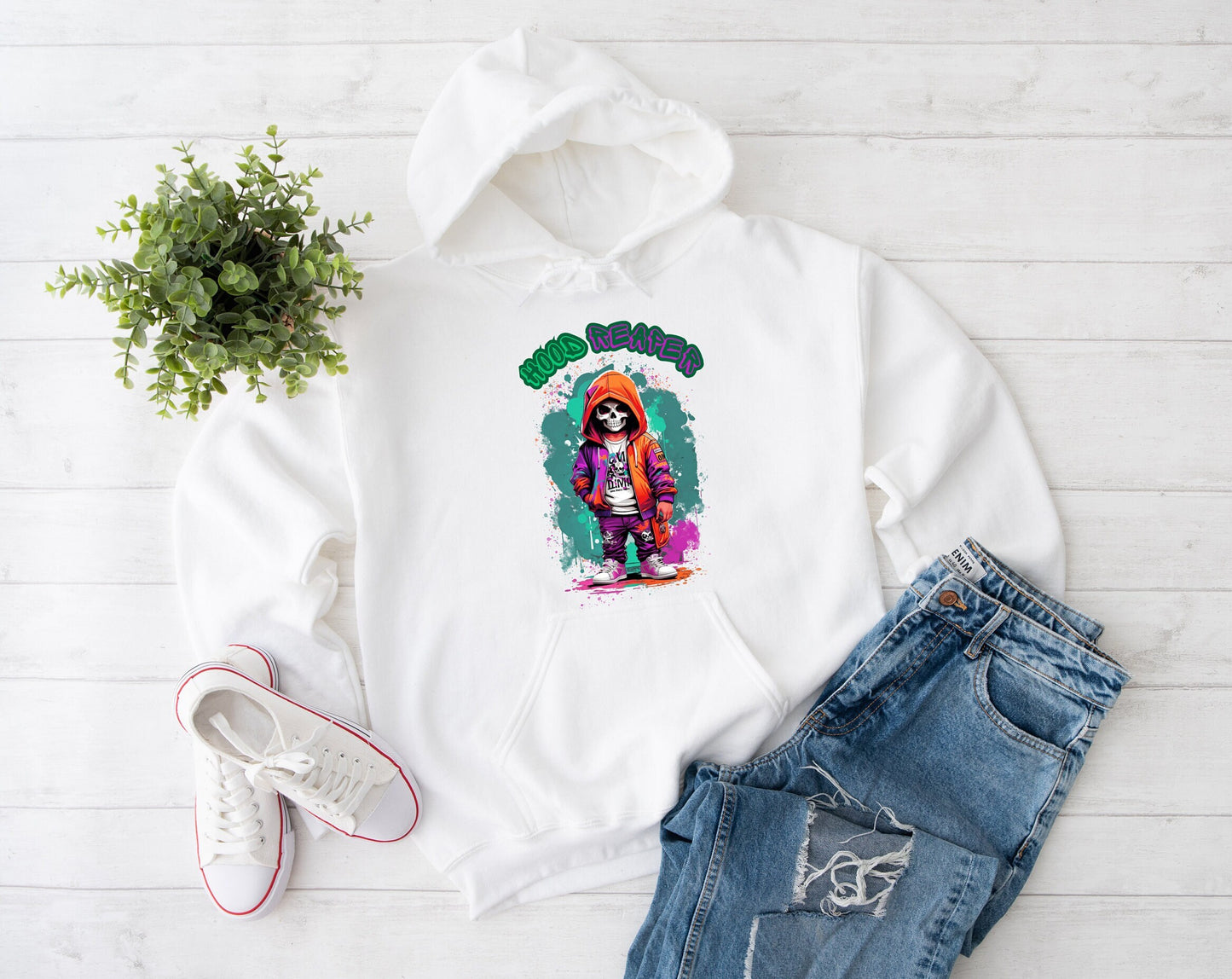 Hood Reaper Skeleton Hoodie by Scorpion Tees and More.  Cute colorful Skeleton with hoodie wearing hip hop style clothing.  This Hoodie will go great with any outfit.  Beautiful design and stylish as well as very warm and comfortable.