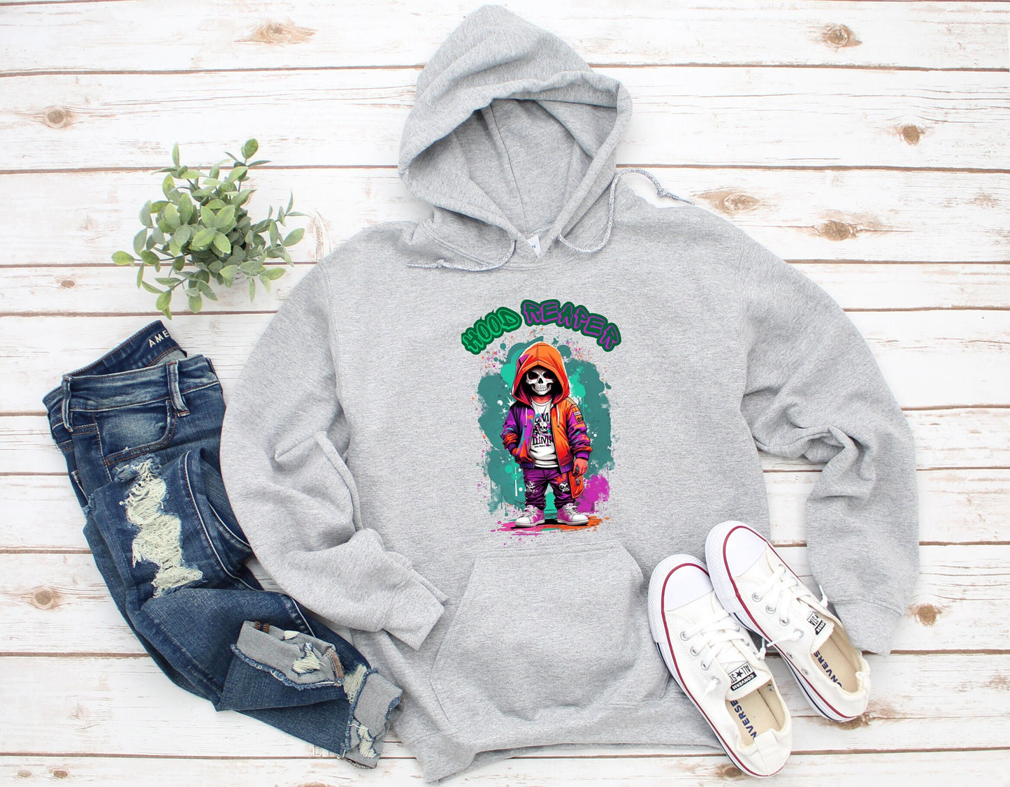 Hood Reaper Skeleton Hoodie by Scorpion Tees and More.  Cute colorful Skeleton with hoodie wearing hip hop style clothing.  This Hoodie will go great with any outfit.  Beautiful design and stylish as well as very warm and comfortable.