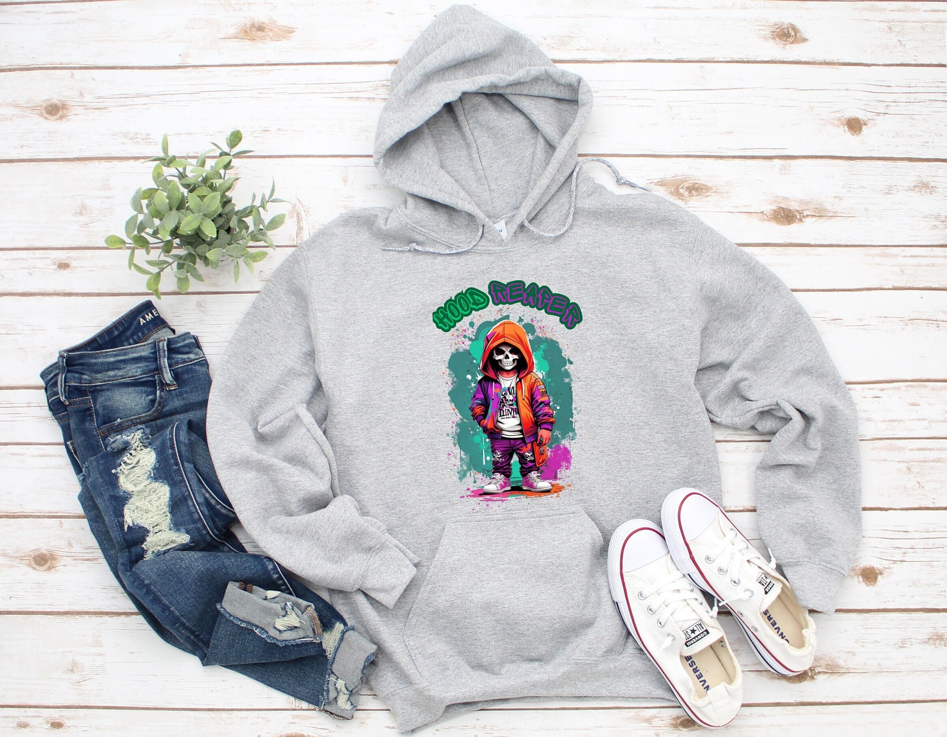 Hood Reaper Skeleton Hoodie by Scorpion Tees and More.  Cute colorful Skeleton with hoodie wearing hip hop style clothing.  This Hoodie will go great with any outfit.  Beautiful design and stylish as well as very warm and comfortable.