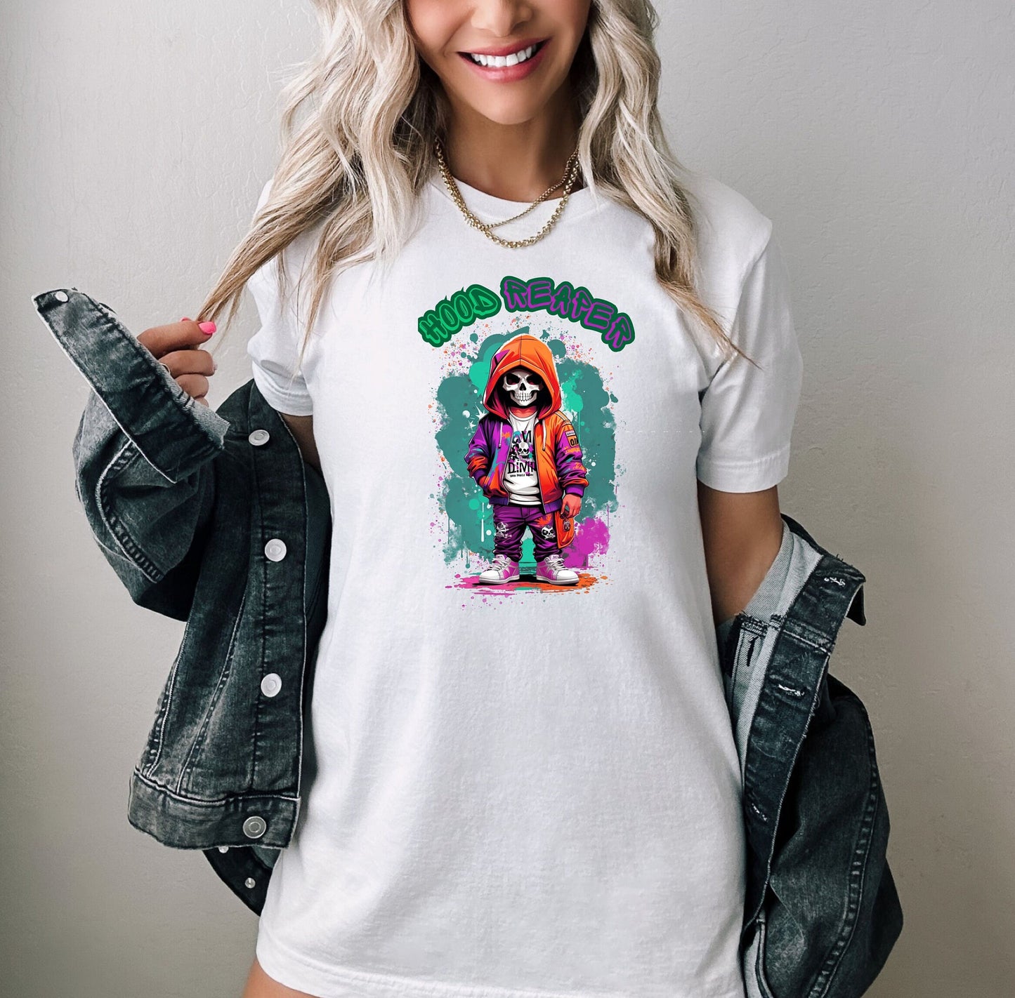 Hood Reaper T shirt by Scorpion Tees and More.  Cute colorful skeleton t shirt.  Skeleton with hoodie wearing hip hop style clothing.  T shirt would go great with any outfit.  Beautiful design and stylish as well as very comfortable.
