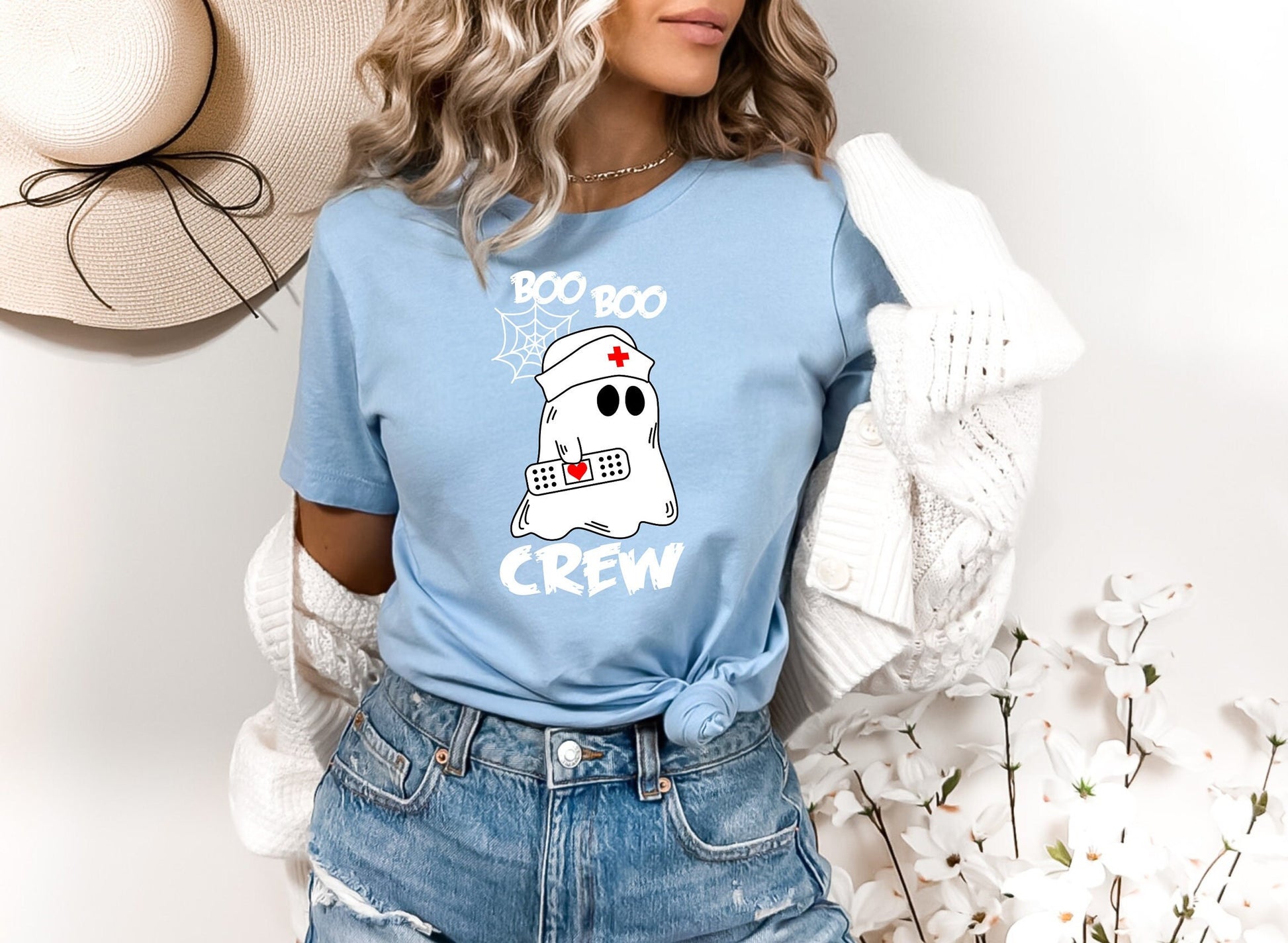 Boo Boo Crew Halloween Ghost nursing shirt.  Cute and comfortable T shirt with and adorable Ghost holding a band aid. This stylish shirt will go well with anything. Makes a perfect gift for nurses.
www.scorpiontees.etsy.com