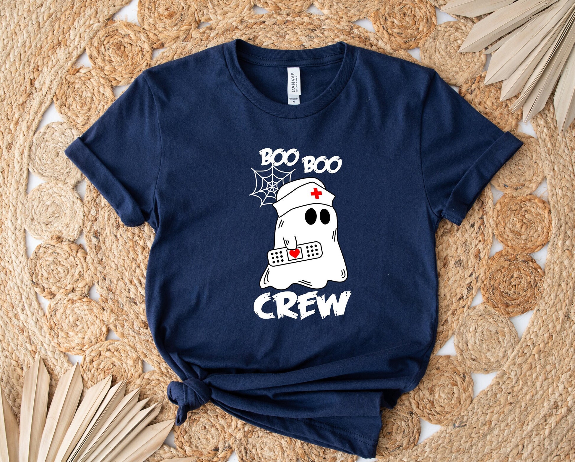 Boo Boo Crew Halloween Ghost nursing shirt.  Cute and comfortable T shirt with and adorable Ghost holding a band aid. This stylish shirt will go well with anything. Makes a perfect gift for nurses.
www.scorpiontees.etsy.com