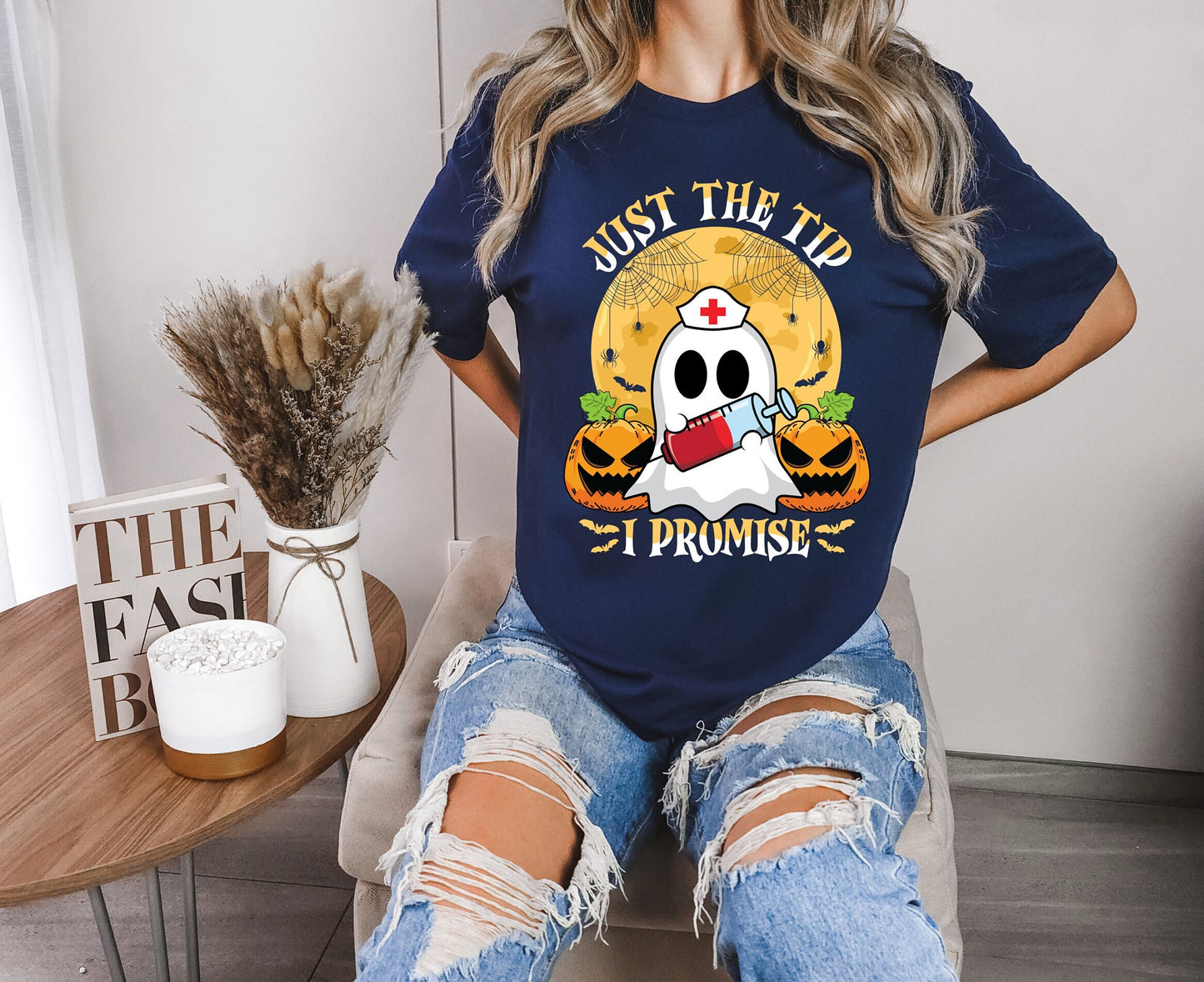 Just the Tip I promise Halloween Nursing Ghost T shirt.  This stylish Tee has a cool design of a Ghost with a nurse hat holding a syringe next to pumpkins spiders and bats. Makes a perfect gift for Halloween and for nurses.
www.scorpiontees.etsy.com