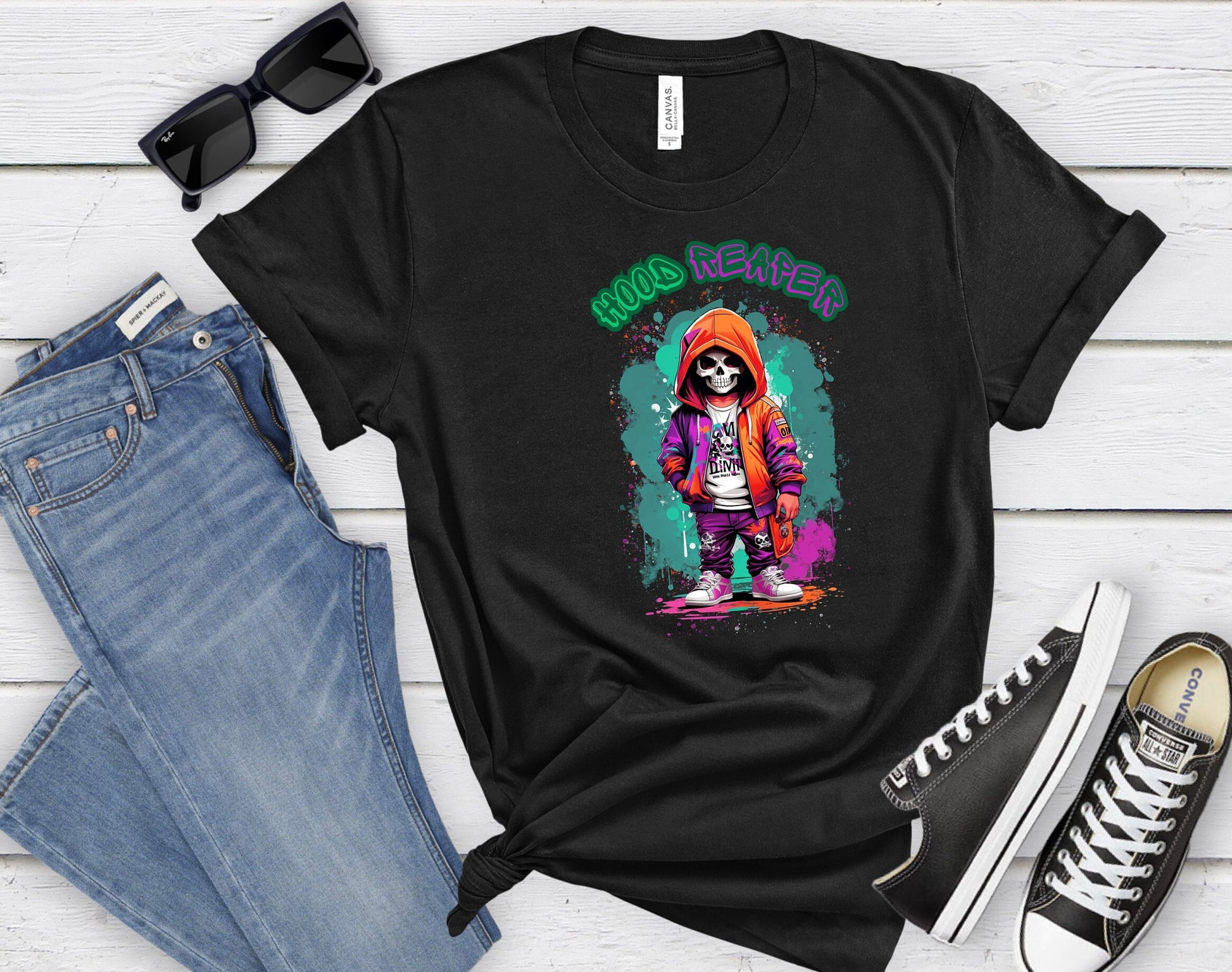 Hood Reaper Skeleton T shirt by Scorpion Tees and More.  Cute colorful skeleton t shirt.  Skeleton with hoodie wearing hip hop style clothing.  T shirt would go great with any outfit.  Beautiful design and stylish as well as very comfortable.