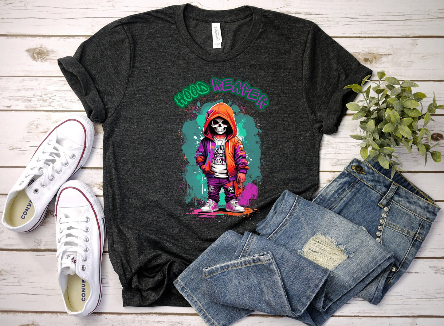 Hood Reaper Skeleton T shirt by Scorpion Tees and More.  Cute colorful skeleton t shirt.  Skeleton with hoodie wearing hip hop style clothing.  T shirt would go great with any outfit.  Beautiful design and stylish as well as very comfortable.