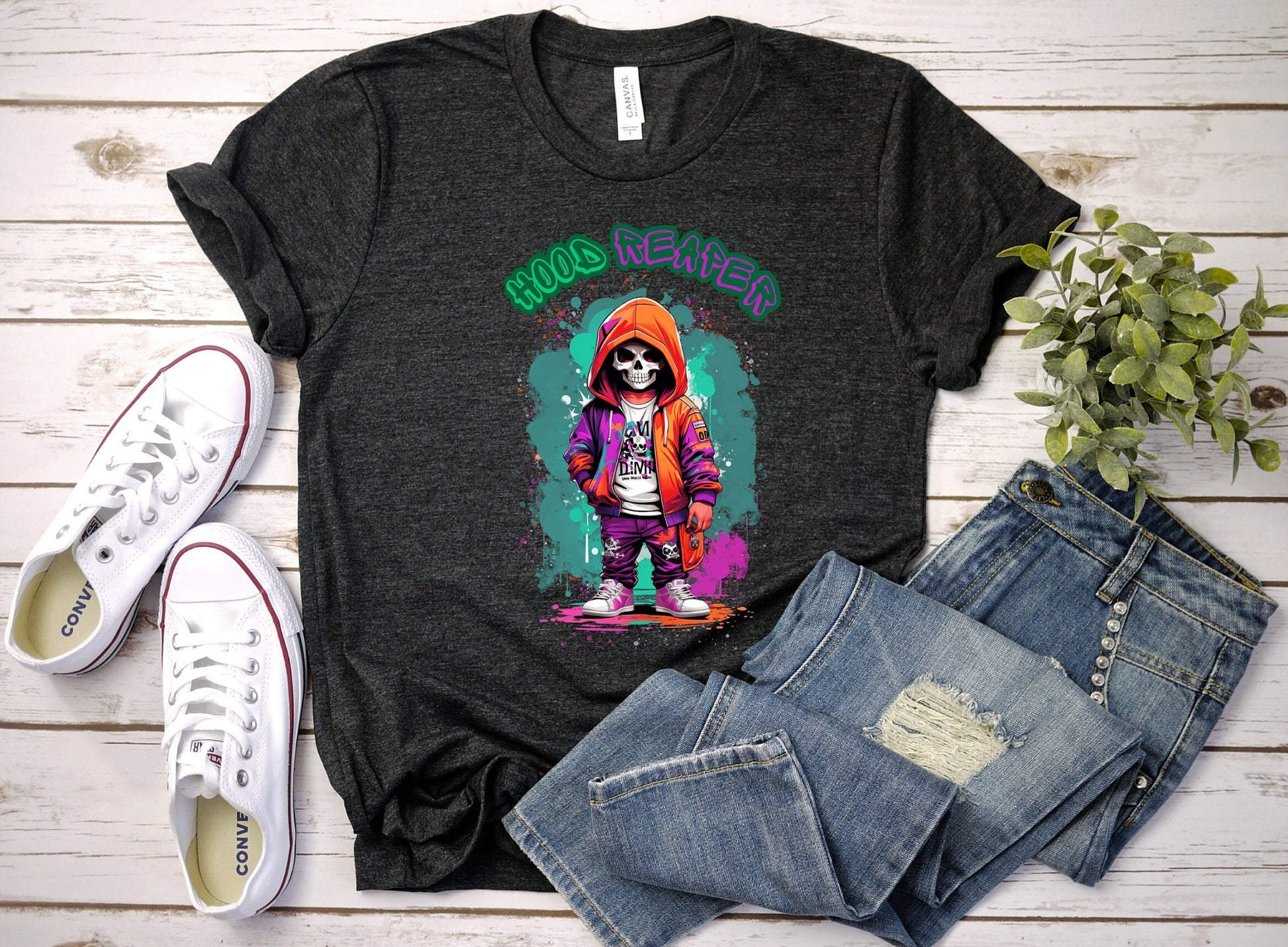 Hood Reaper Skeleton T shirt by Scorpion Tees and More.  Cute colorful skeleton t shirt.  Skeleton with hoodie wearing hip hop style clothing.  T shirt would go great with any outfit.  Beautiful design and stylish as well as very comfortable.