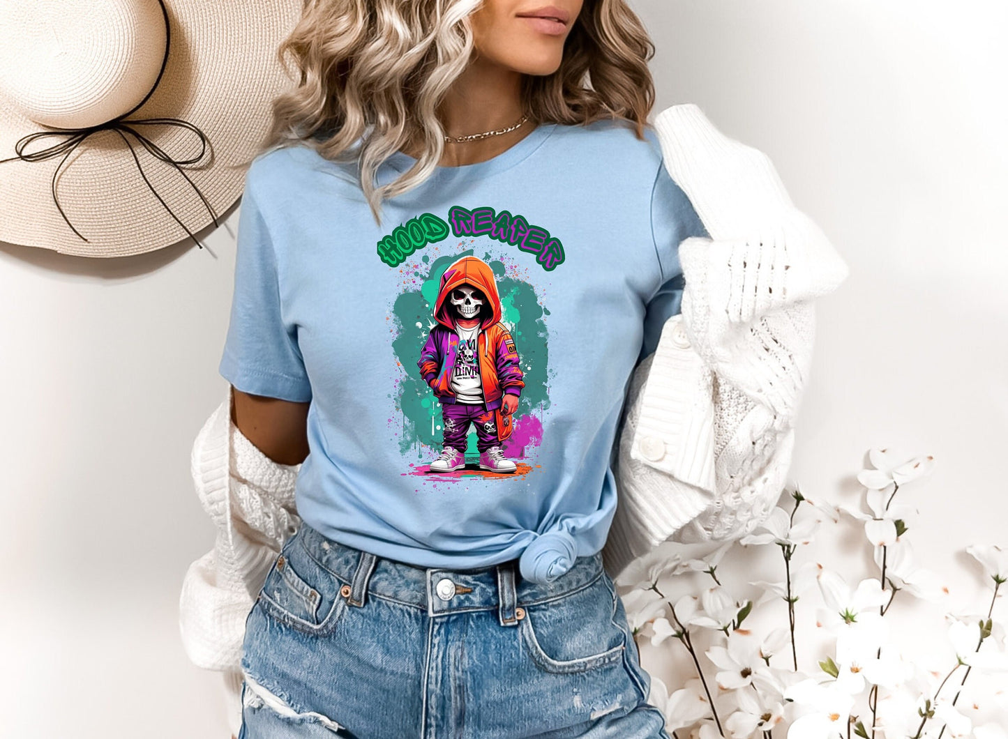 hood Reaper Skeleton T shirt by Scorpion Tees and More.  Cute colorful skeleton t shirt.  Skeleton with hoodie wearing hip hop style clothing.  T shirt would go great with any outfit.  Beautiful design and stylish as well as very comfortable.
