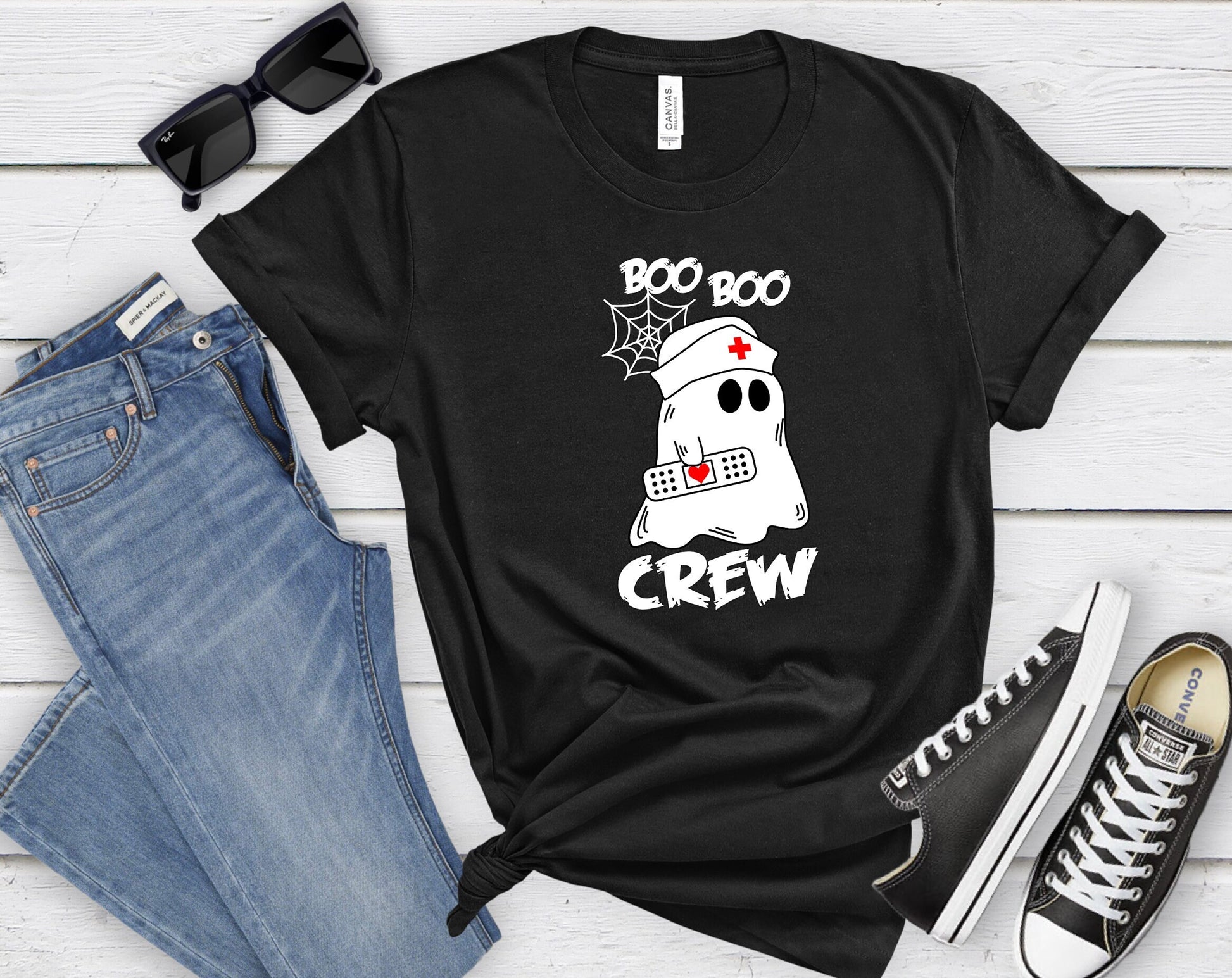 Boo Boo Crew Halloween Ghost nursing shirt.  Cute and comfortable T shirt with and adorable Ghost holding a band aid. This stylish shirt will go well with anything. Makes a perfect gift for nurses.
www.scorpiontees.etsy.com