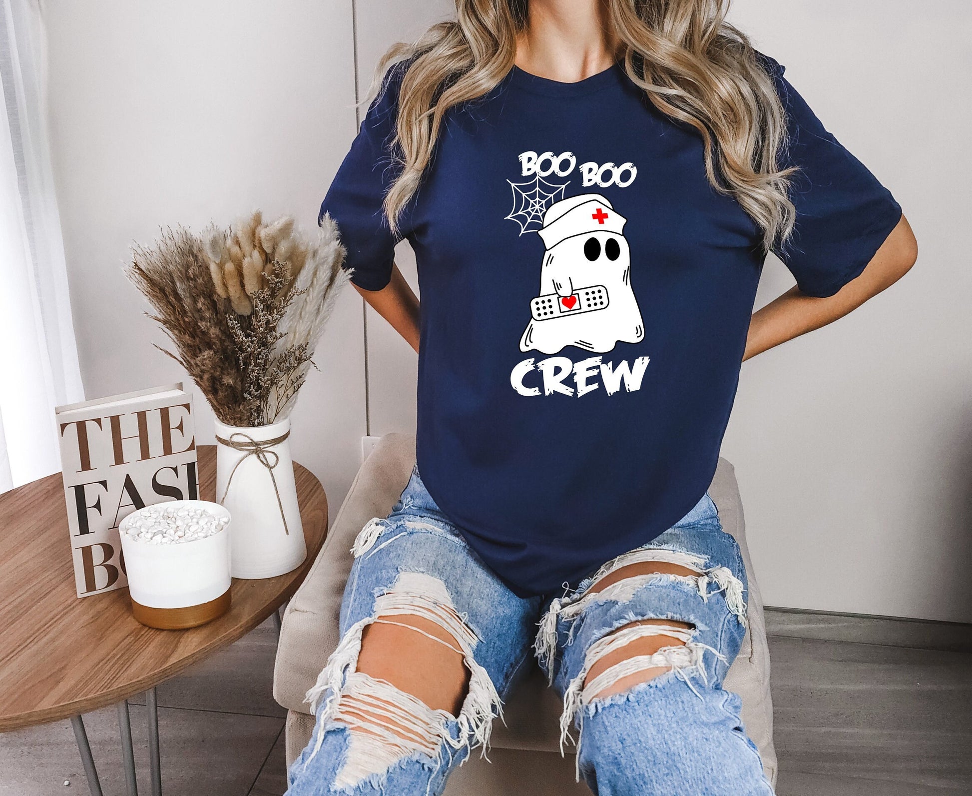 Boo Boo Crew Halloween Ghost nursing shirt.  Cute and comfortable T shirt with and adorable Ghost holding a band aid. This stylish shirt will go well with anything. Makes a perfect gift for nurses.
www.scorpiontees.etsy.com