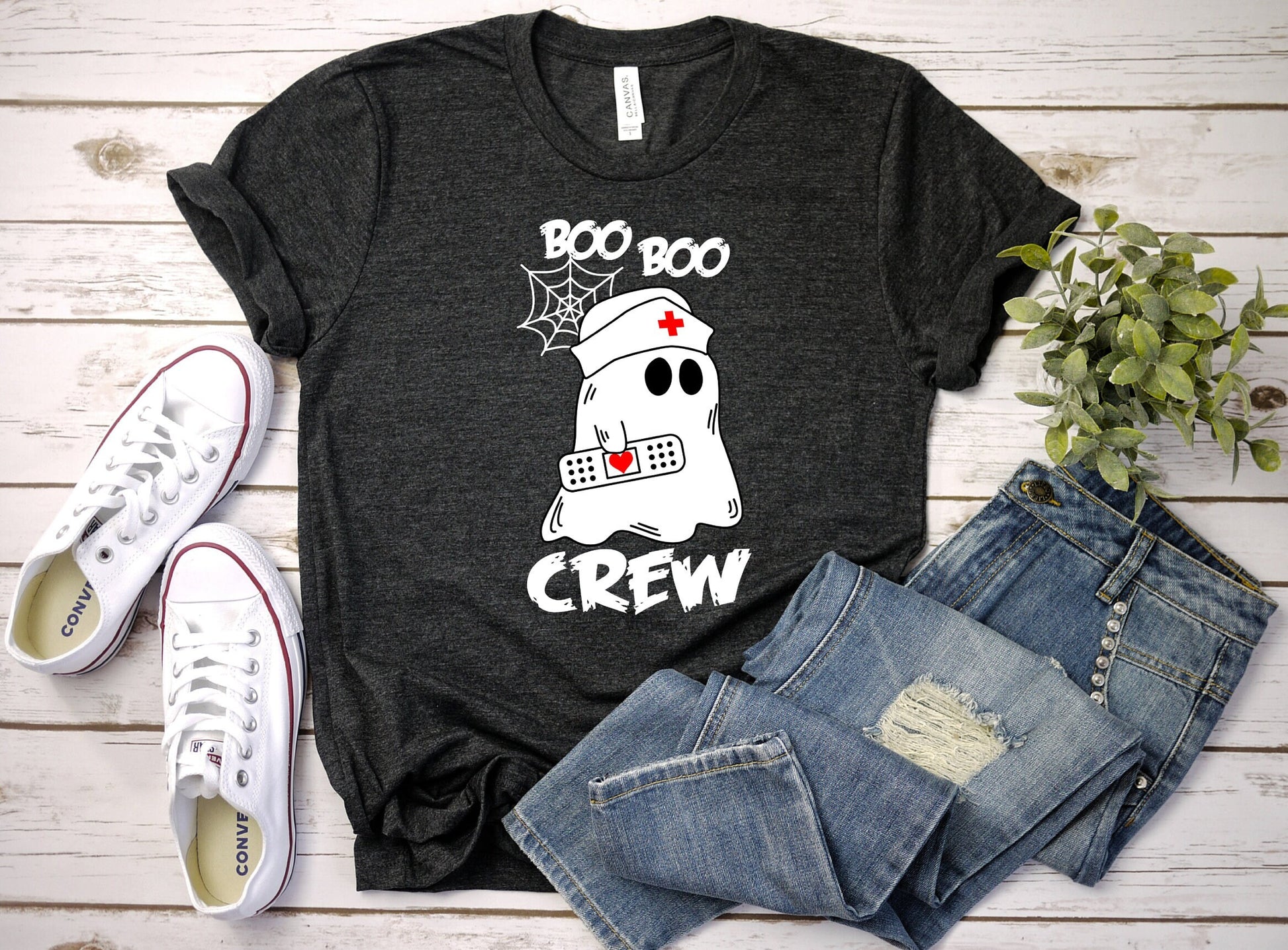 Boo Boo Crew Halloween Ghost nursing shirt.  Cute and comfortable T shirt with and adorable Ghost holding a band aid. This stylish shirt will go well with anything. Makes a perfect gift for nurses.
www.scorpiontees.etsy.com