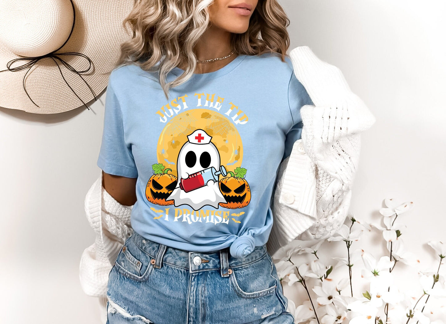 Just the Tip I promise Halloween Nursing Ghost T shirt.  This stylish Tee has a cool design of a Ghost with a nurse hat holding a syringe next to pumpkins spiders and bats. Makes a perfect gift for Halloween and for nurses.
www.scorpiontees.etsy.com