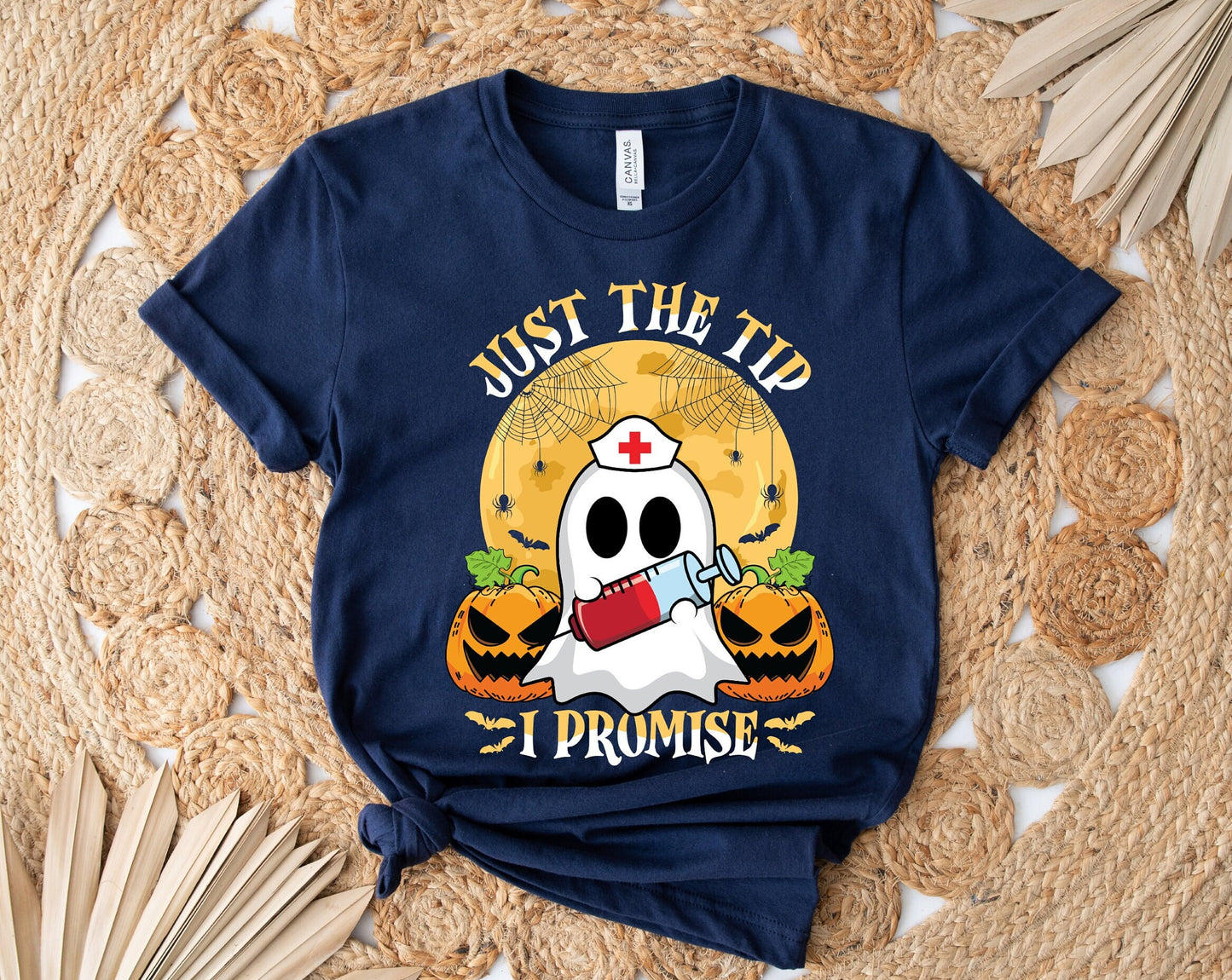 Just the Tip I promise Halloween Nursing Ghost T shirt.  This stylish Tee has a cool design of a Ghost with a nurse hat holding a syringe next to pumpkins spiders and bats. Makes a perfect gift for Halloween and for nurses.
www.scorpiontees.etsy.com